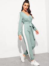 Load image into Gallery viewer, Surplice Neck Self Belted Colorblock Jumpsuit