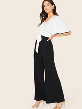 Load image into Gallery viewer, Two Tone Contrast Binding Tie Side Flare Leg Jumpsuit