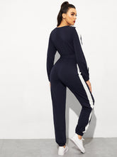 Load image into Gallery viewer, Surplice Neck Self Belted Colorblock Jumpsuit